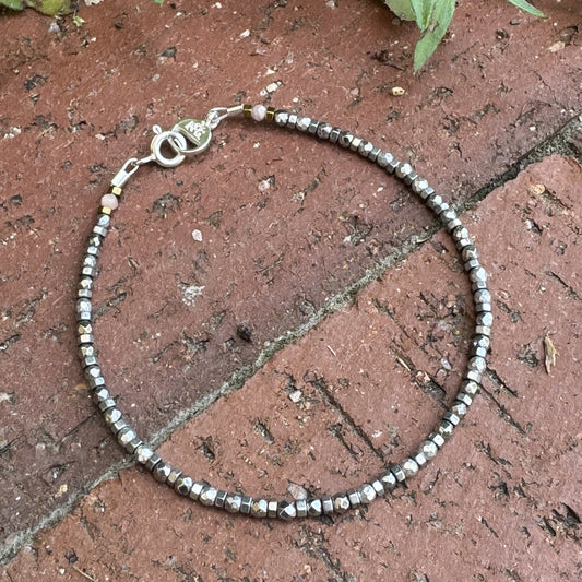 Handcrafted Hematite gemstone bracelet with subtle Rodochrosite accents, inspired by the mining town of Silverton, Colorado