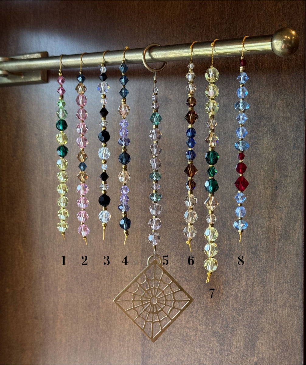 Eight strands of vintage crystals in different colors